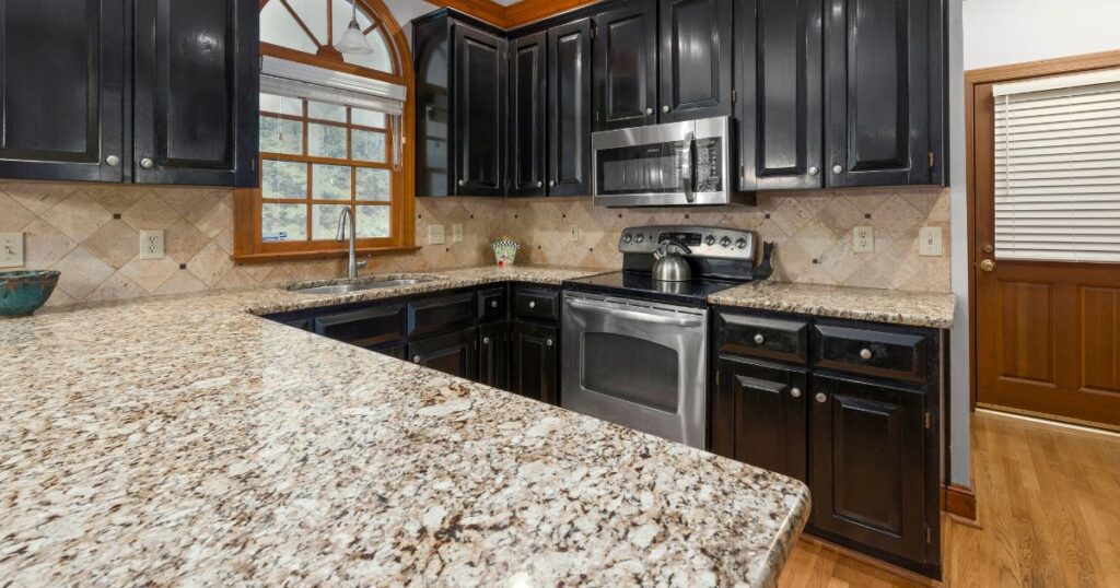 Modern kitchen with light countertops, wood cabinets, and a neutral color palette