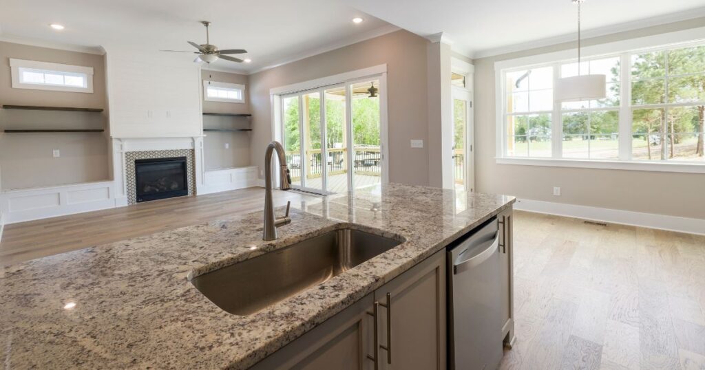 Remodeled Boise kitchen featuring elegant stone countertops, custom cabinetry, and a spacious kitchen island.